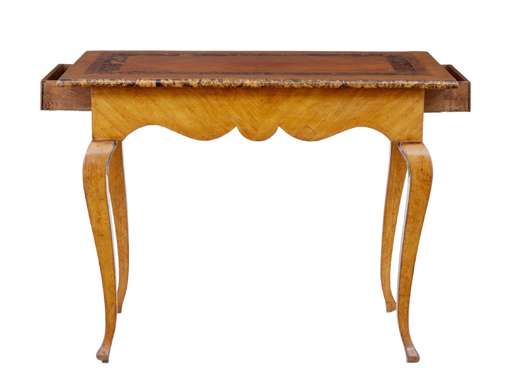 A mid 19th-century Swedish rectangular occasional table crafted from golden brown alder root wood with slender cabriole legs and a contoured apron. View IV