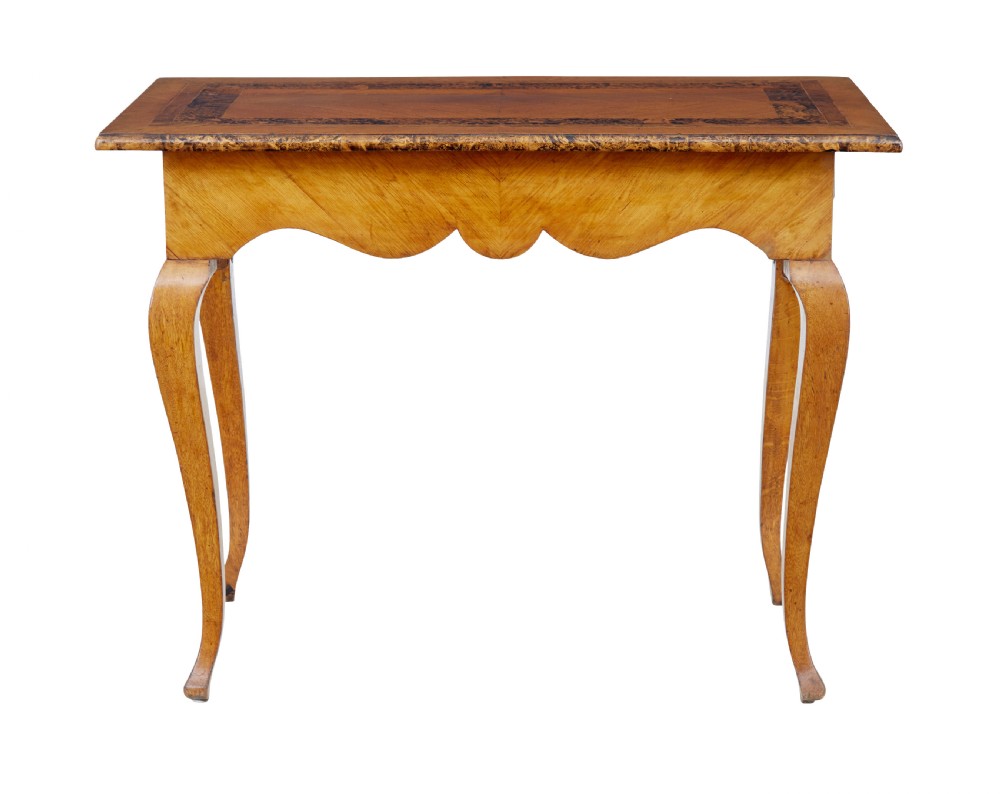 A mid 19th-century Swedish rectangular occasional table crafted from golden brown alder root wood with slender cabriole legs and a contoured apron. View VI