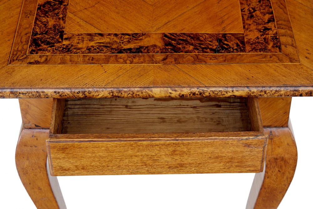 A mid 19th-century Swedish rectangular occasional table crafted from golden brown alder root wood with slender cabriole legs and a contoured apron. View IX