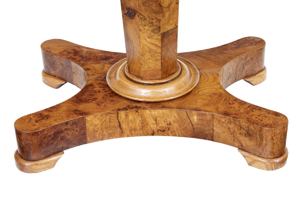 A nineteenth-century Swedish burr elm teapoy featuring an octagonal casket lid, a faceted pedestal column, and a shaped plinth base. View II