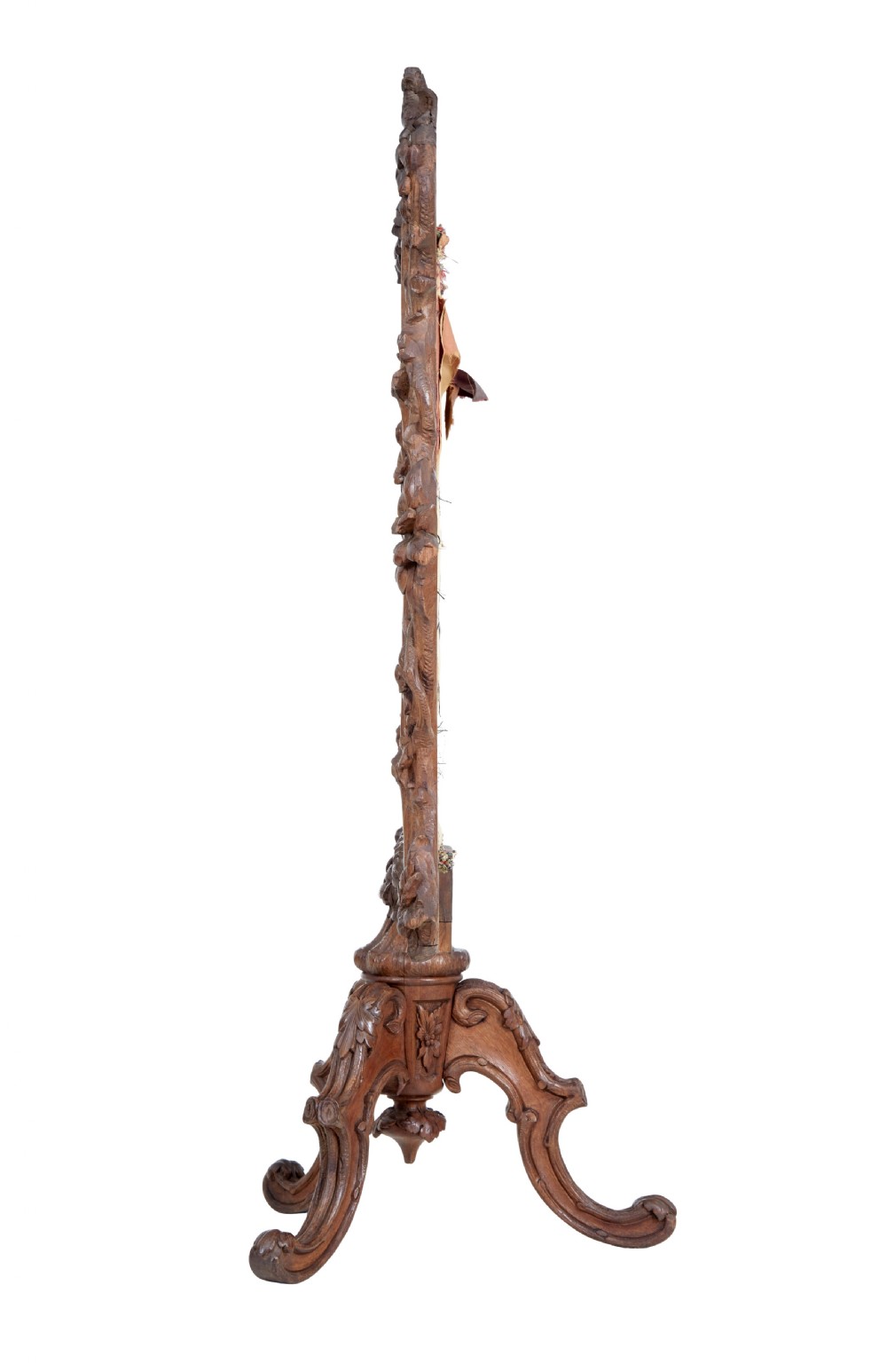 A carved oak tripod fire screen with a crest carved as a bird surrounding a woven tapestry panel featuring pineapple motifs. View VI