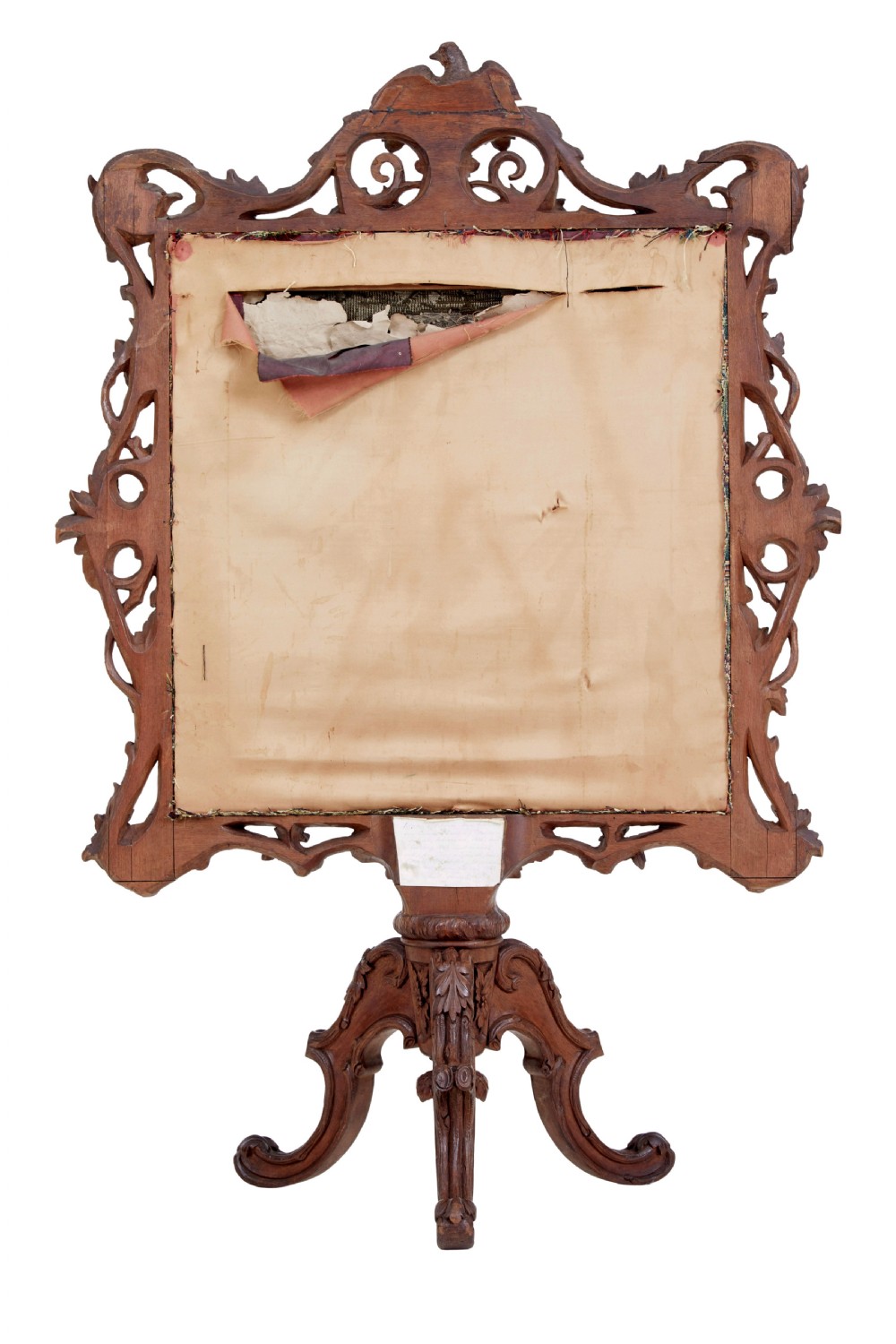 A carved oak tripod fire screen with a crest carved as a bird surrounding a woven tapestry panel featuring pineapple motifs. View VII