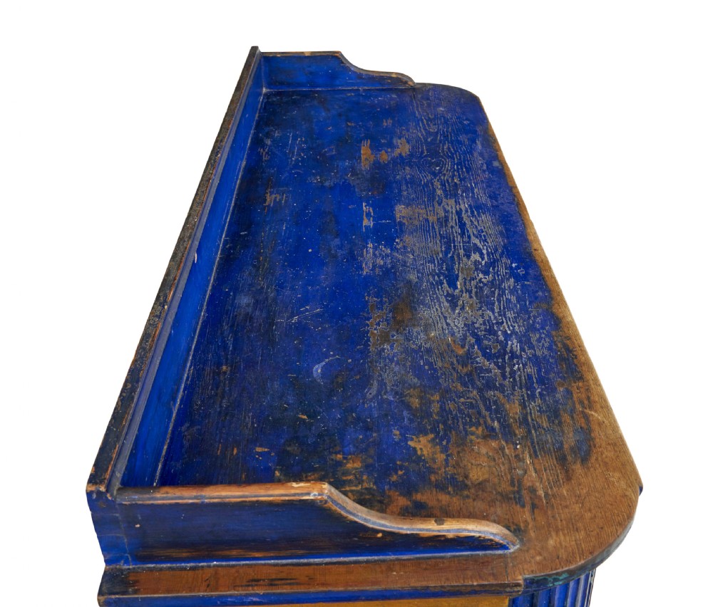 A 19th-century Swedish pine kitchen cupboard with ochre faux-grained body, vibrant blue fluted columns, two top drawers, and blue panelled double doors. View XI