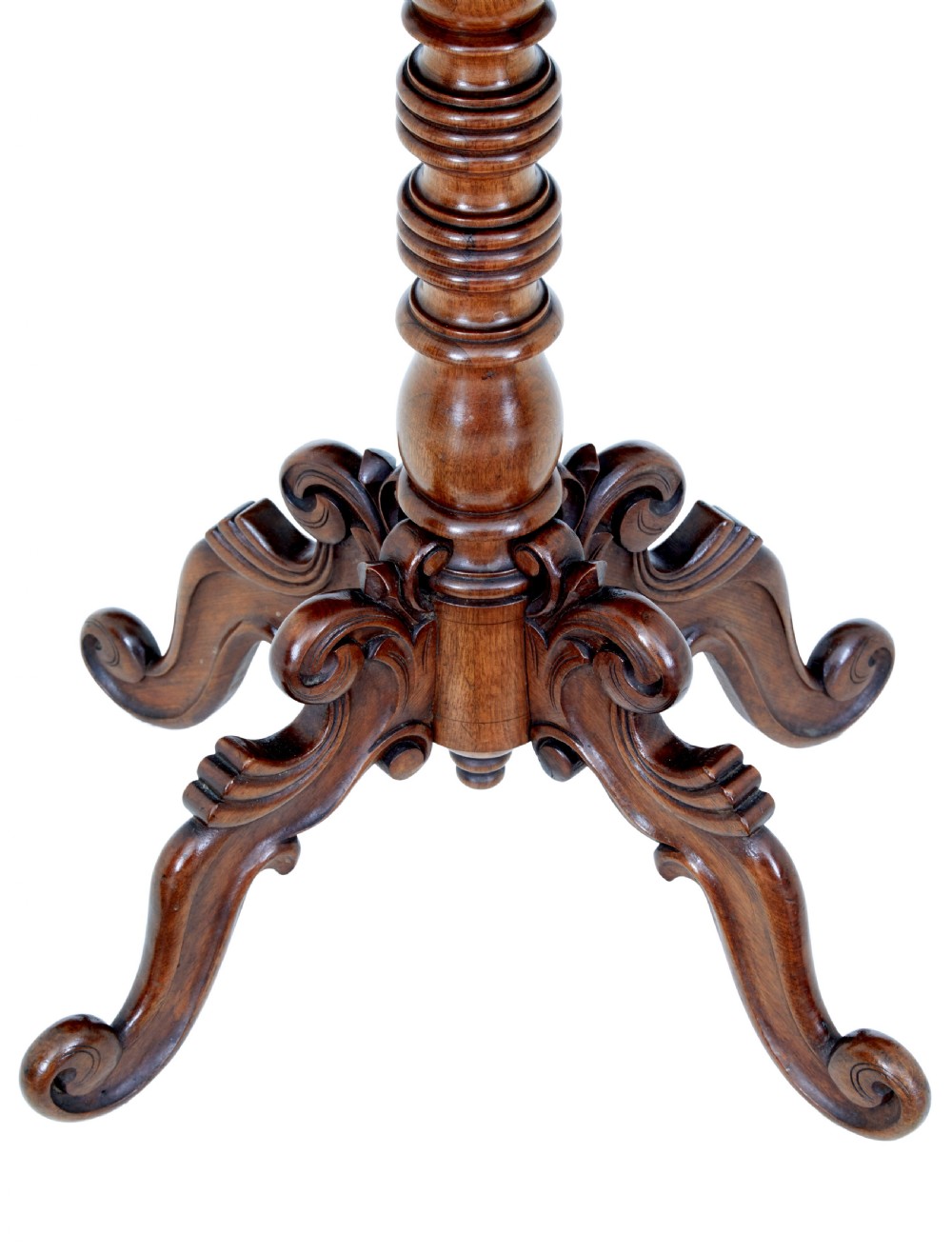A 19th-century flame mahogany side table with a shaped top, turned central column stem, and detailed carved scroll feet. View VII