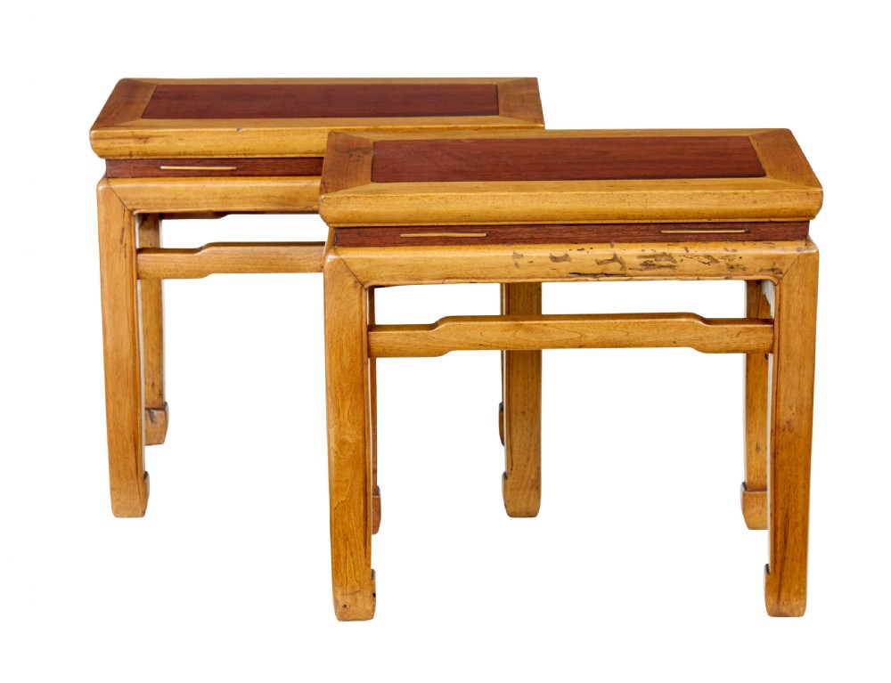 A pair of late nineteenth-century Chinese hardwood occasional tables featuring rectangular tops with inset panels, straight legs, and subtle waist aprons. View V