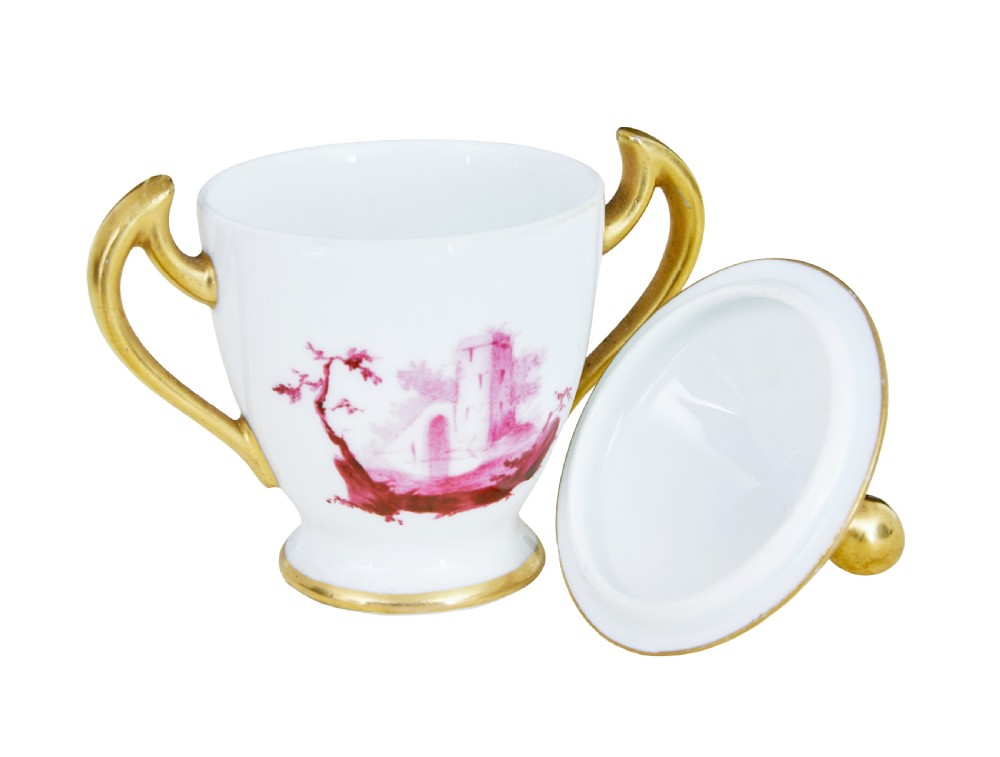 A seven-piece French porcelain dessert set featuring six twin-handled covered cream pots and a matching shaped tray, decorated with pink landscape scenes and gilded handles. View VII