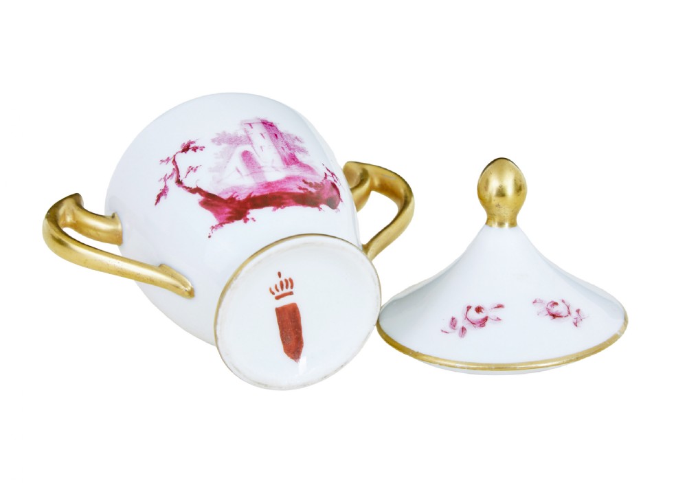 A seven-piece French porcelain dessert set featuring six twin-handled covered cream pots and a matching shaped tray, decorated with pink landscape scenes and gilded handles. View VIII