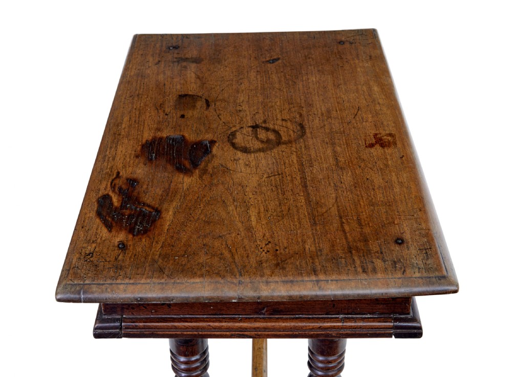 An 18th-century rustic walnut side table featuring turned legs, a single drawer with wooden knobs, and a low stretcher base. View II