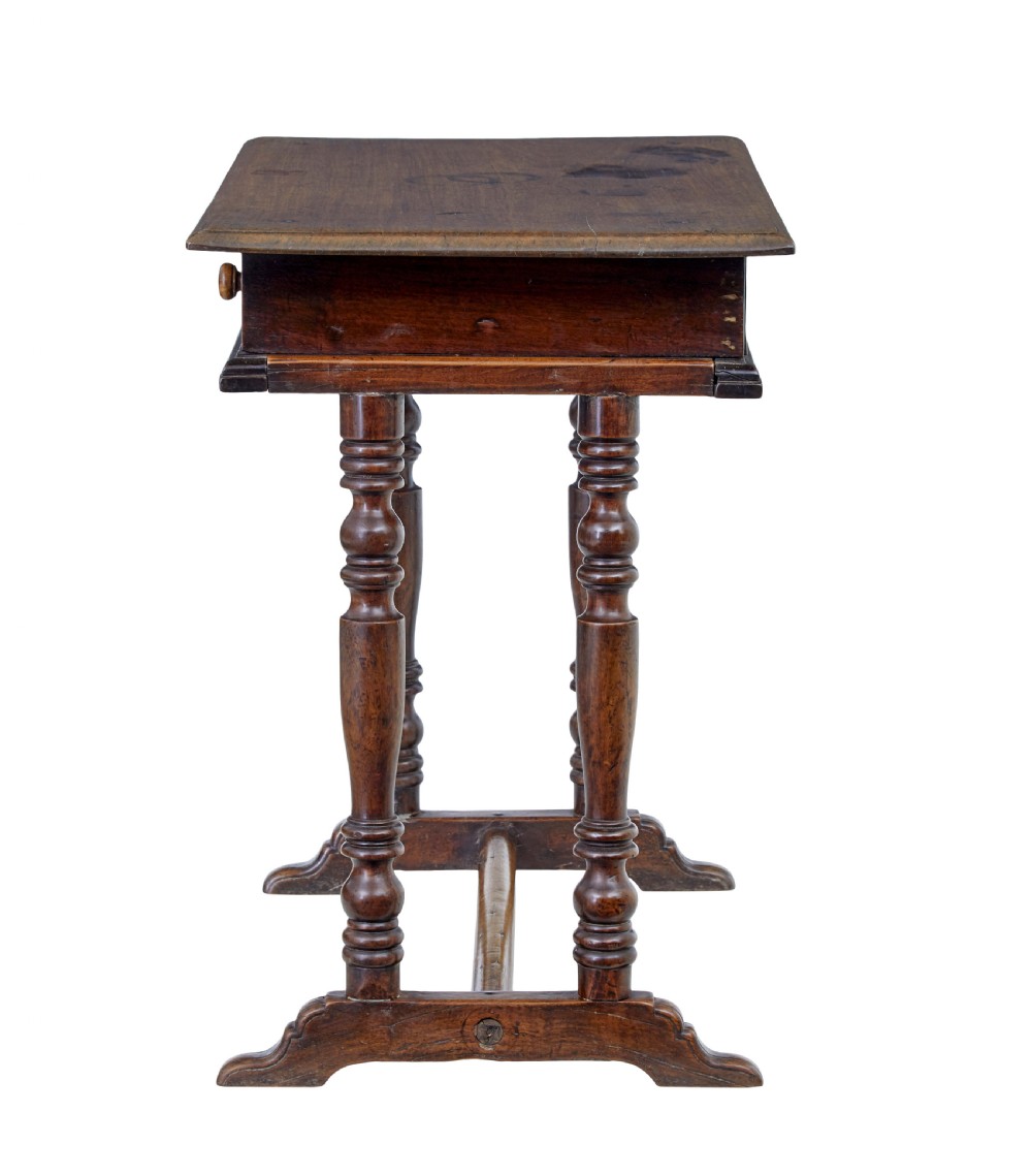 An 18th-century rustic walnut side table featuring turned legs, a single drawer with wooden knobs, and a low stretcher base. View VII