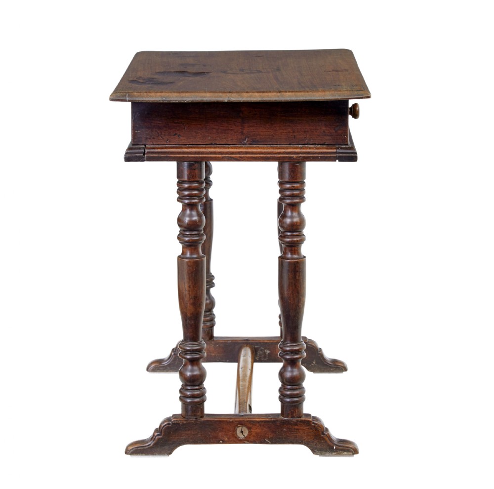 An 18th-century rustic walnut side table featuring turned legs, a single drawer with wooden knobs, and a low stretcher base. View VIII