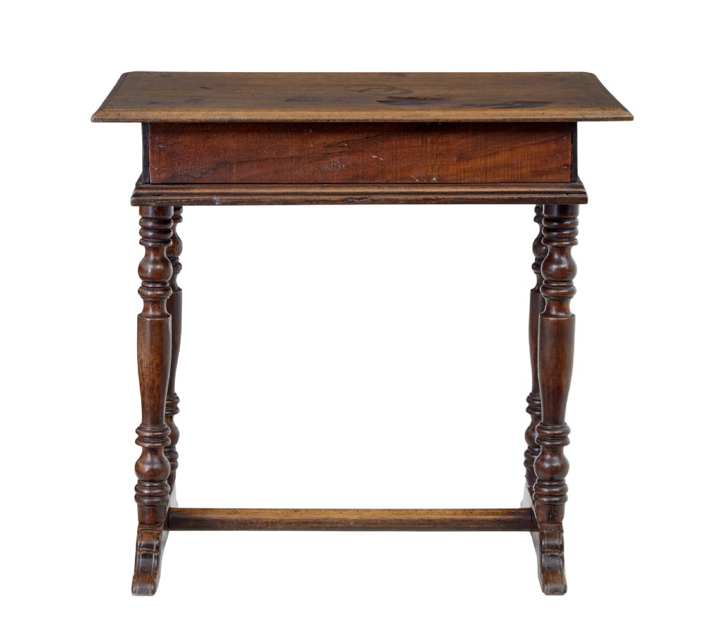 An 18th-century rustic walnut side table featuring turned legs, a single drawer with wooden knobs, and a low stretcher base. View IX