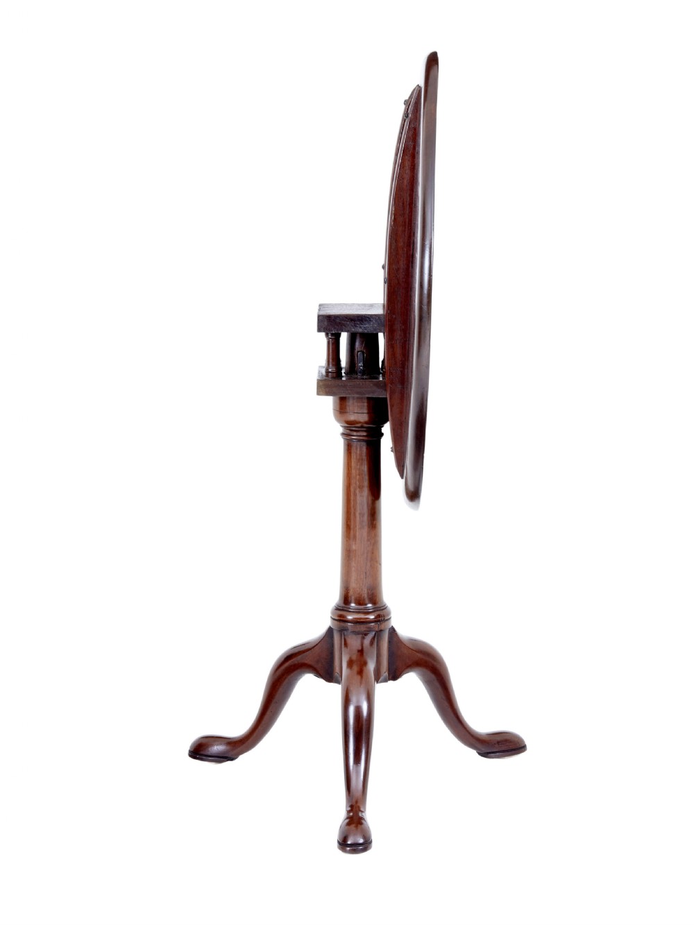 An early 19th-century Georgian mahogany tripod table with a circular tilt top, turned central column, and three cabriole legs on pad feet. View II