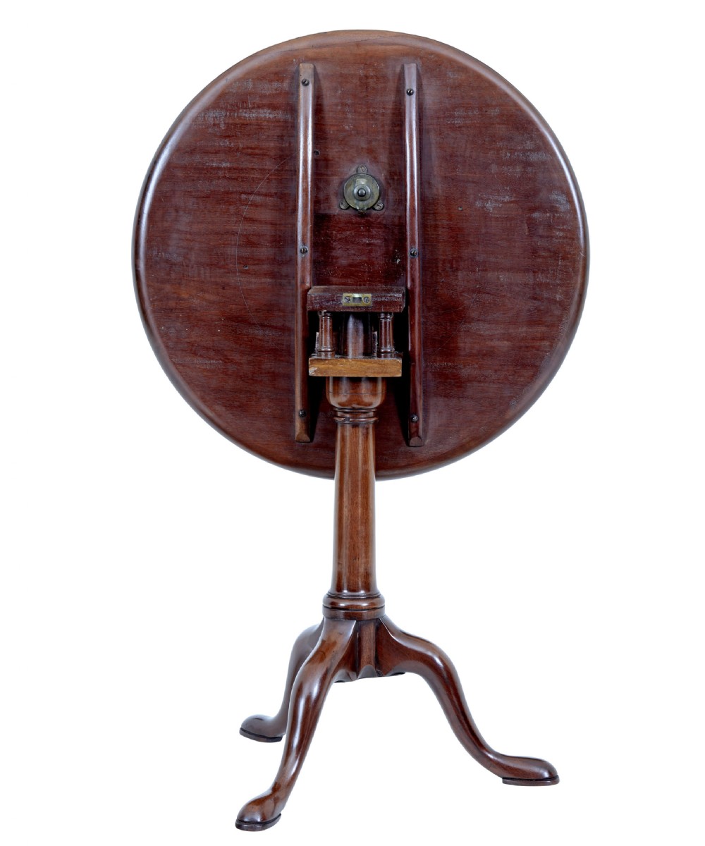An early 19th-century Georgian mahogany tripod table with a circular tilt top, turned central column, and three cabriole legs on pad feet. View III