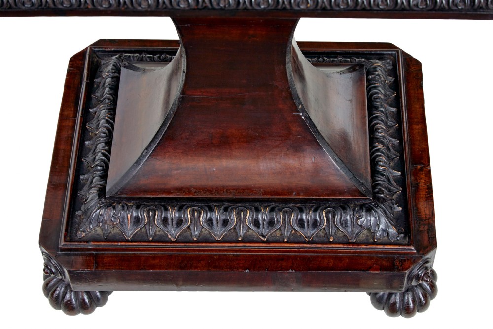 A 19th-century carved mahogany teapoy featuring a stepped hinged lid, flared central pedestal base, and carved feet. View IX