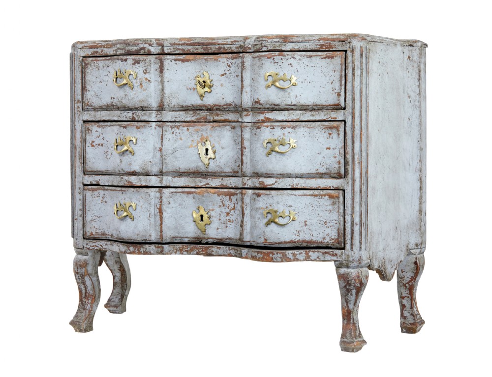 An early nineteenth-century Swedish Baroque Revival chest featuring three drawers with a distressed light blue painted finish and decorative brass handles. View X