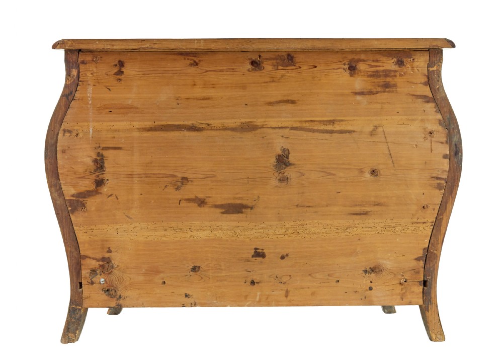 An early 18th-century Rococo bombe chest of drawers featuring geometric parquetry inlay in plumwood and three drawers with ornate brass handles. View VI