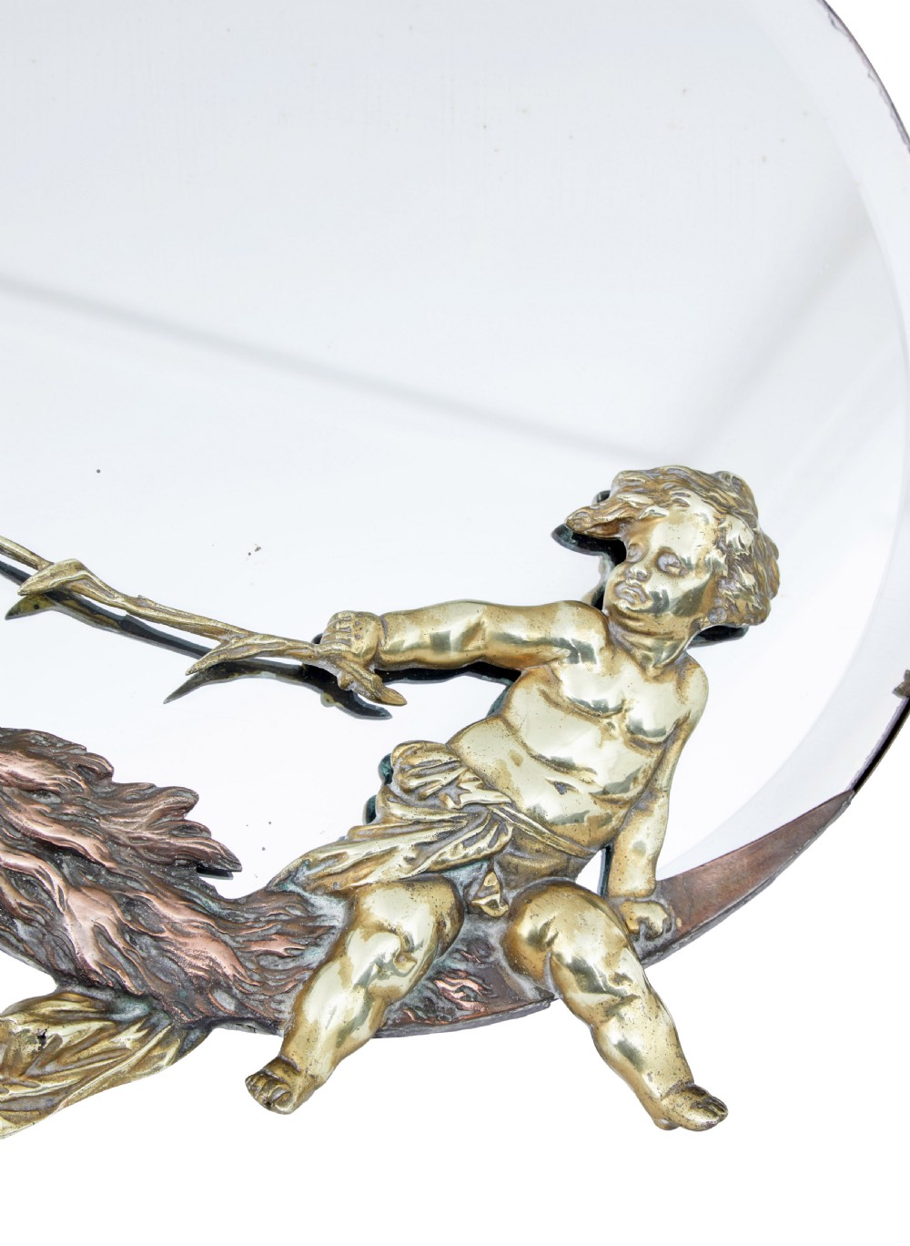 A circular table mirror featuring a cast bronze crescent man-in-the-moon frame and a brass cherub seated along the bottom edge. View V