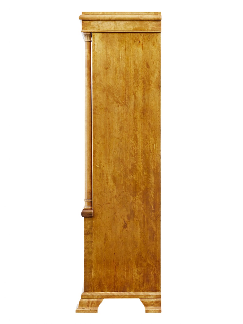 An early twentieth-century Empire Revival satin birch bookcase cabinet featuring open adjustable upper shelving and three lower panelled cupboard doors with a central carved drape motif. View V