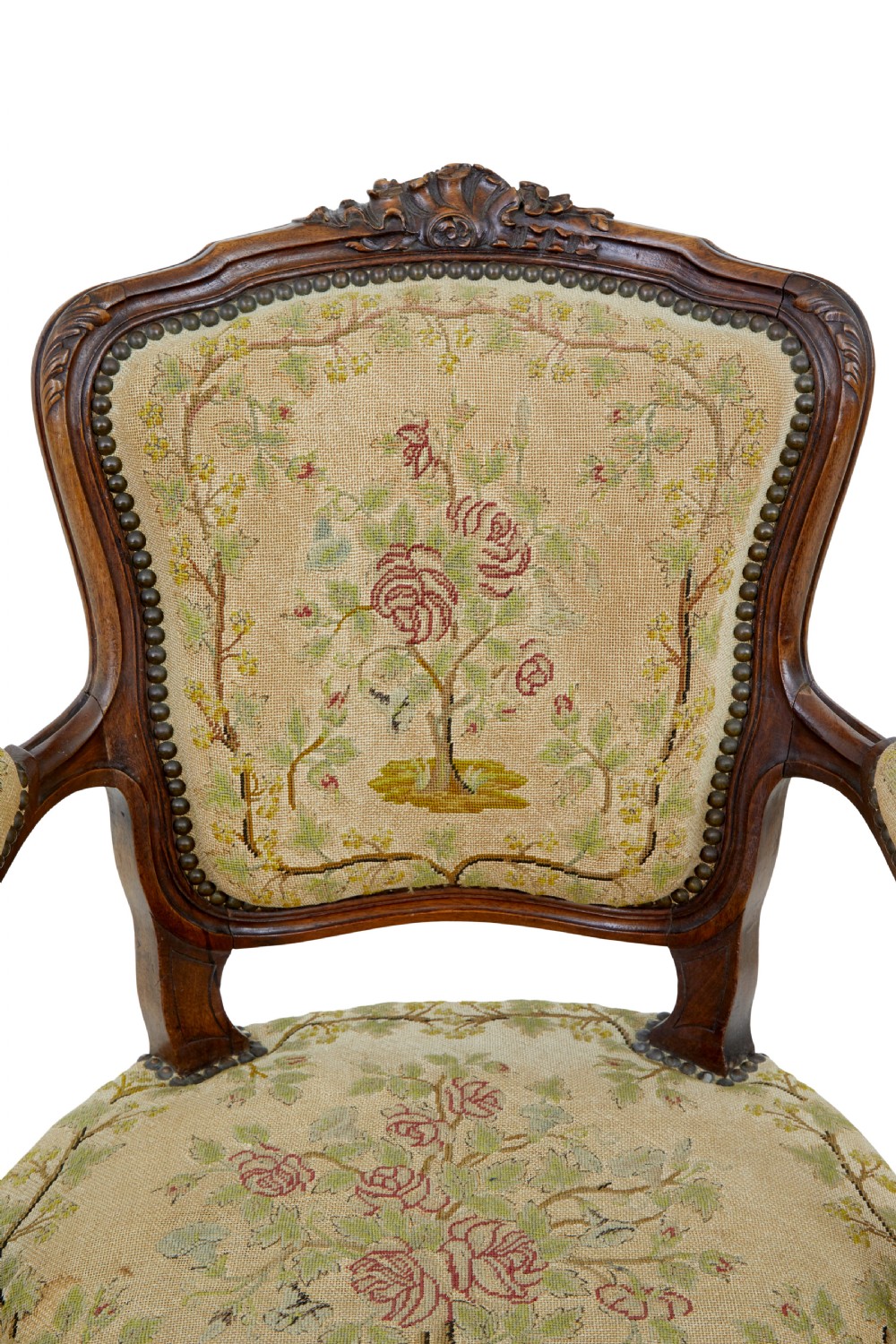 A pair of 19th-century French fauteuil armchairs with carved walnut frames and floral needlepoint upholstered seats and backs. View VI