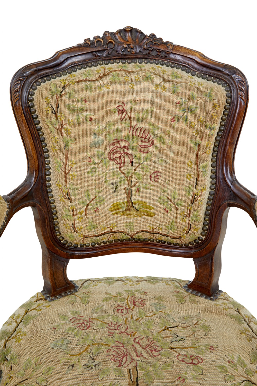 A pair of 19th-century French fauteuil armchairs with carved walnut frames and floral needlepoint upholstered seats and backs. View VII