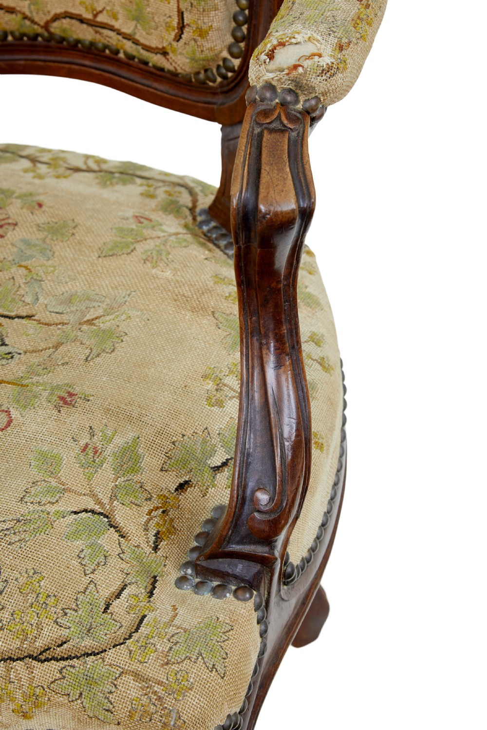 A pair of 19th-century French fauteuil armchairs with carved walnut frames and floral needlepoint upholstered seats and backs. View X