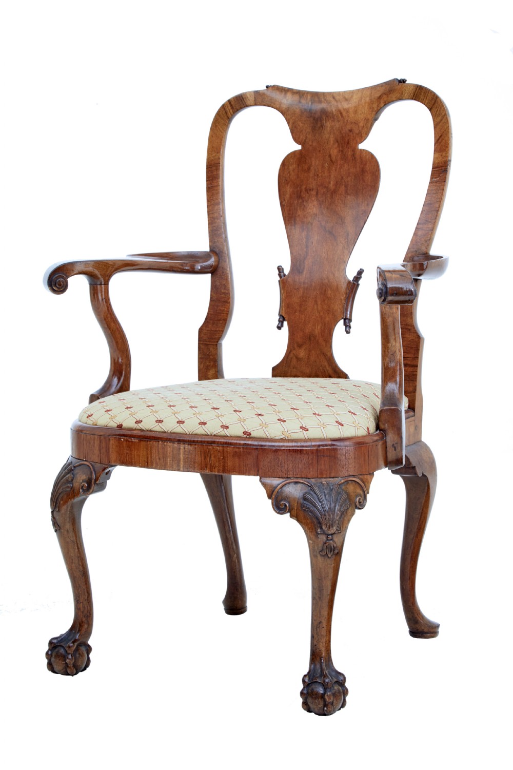 A set of carved walnut dining chairs featuring vasiform splat backs, upholstered drop-in seats, and cabriole legs ending in claw and ball feet. View II