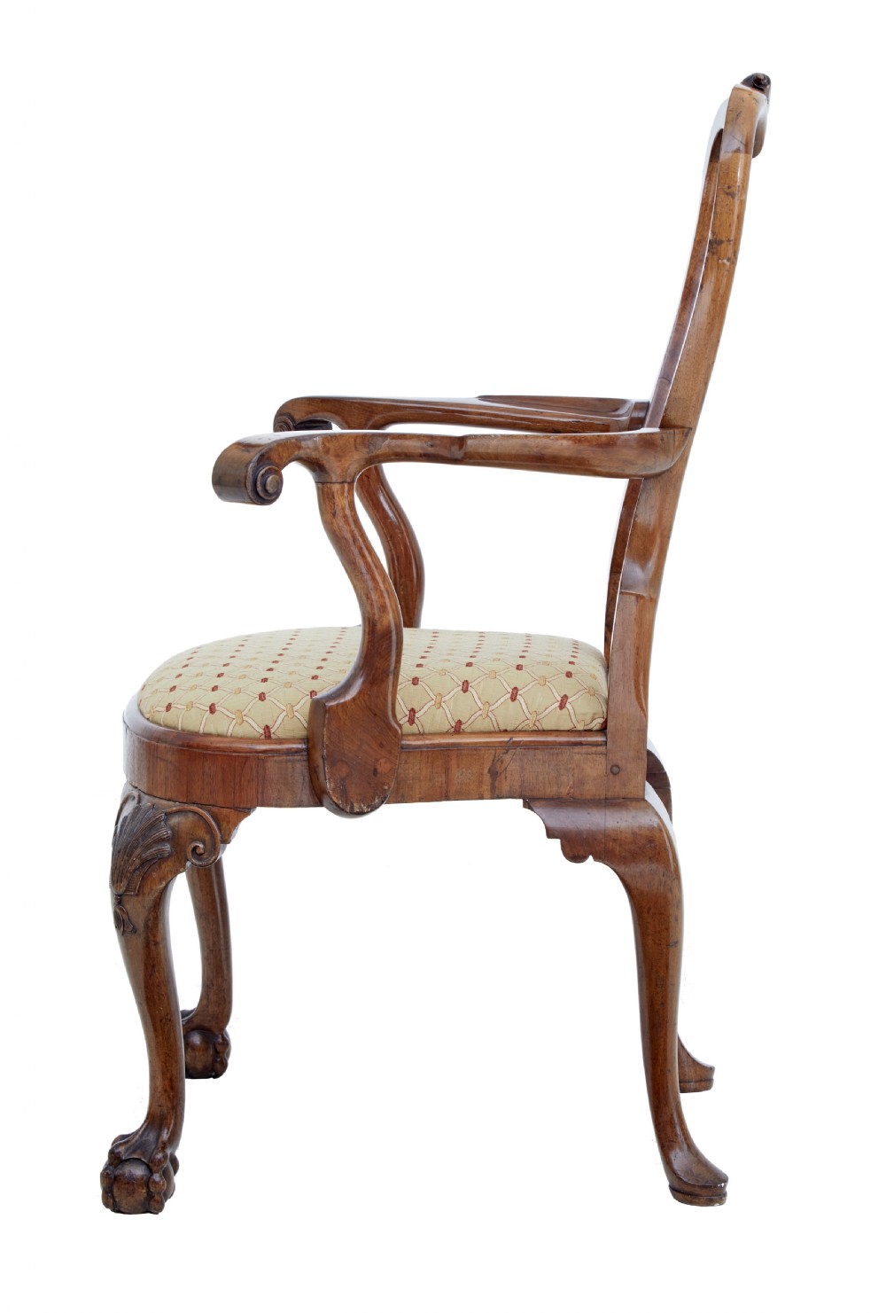 A set of carved walnut dining chairs featuring vasiform splat backs, upholstered drop-in seats, and cabriole legs ending in claw and ball feet. View III