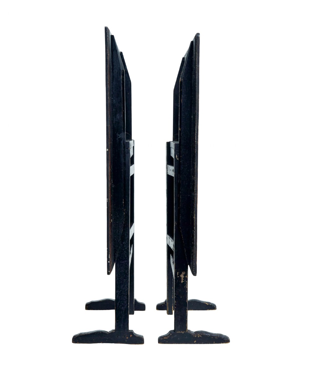 A pair of 19th-century Swedish folding tables featuring square tops with mottled brown ragwork painted surfaces supported on dark painted trestle bases. View III