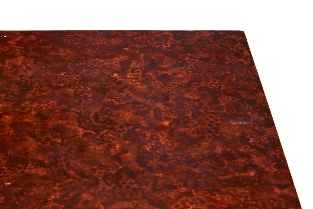 A pair of 19th-century Swedish folding tables featuring square tops with mottled brown ragwork painted surfaces supported on dark painted trestle bases. View X