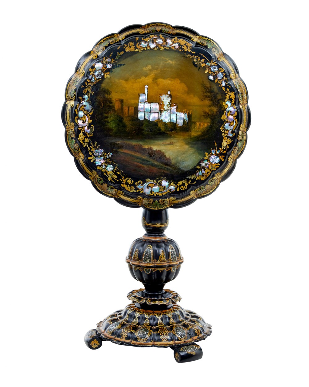 A 19th-century black lacquered papier-mache tilt-top table with a scalloped edge, hand-painted landscape, mother-of-pearl inlay, and gilded floral scrollwork on a turned pedestal.
