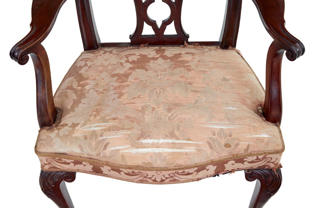 A pair of early 20th-century Chippendale Revival mahogany armchairs featuring carved pierced splat backs, serpentine top rails, curved arms, and cabriole legs. View II