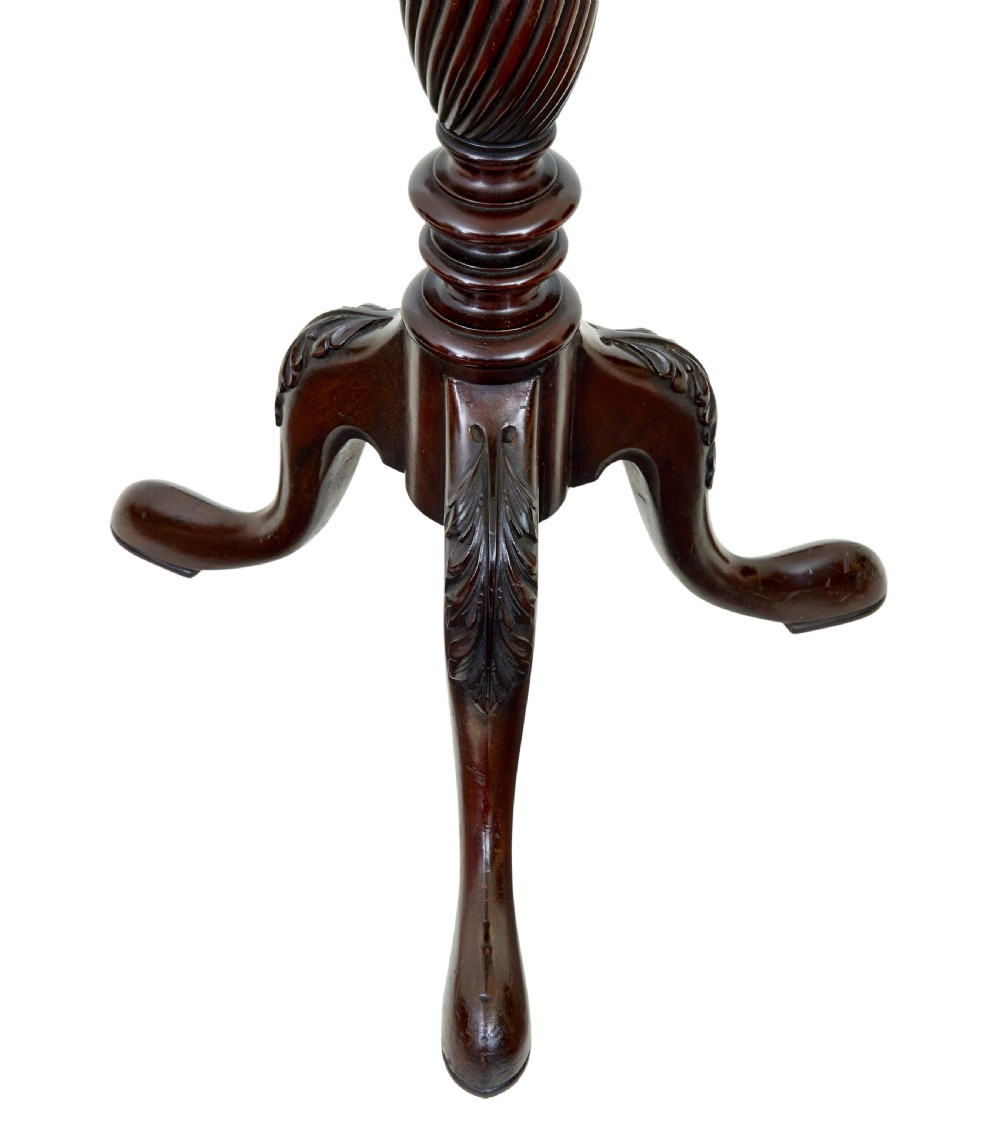 An early 20th-century carved mahogany torchere stand featuring a shaped top, a fluted column with acanthus leaf details, and a tripod base with pad feet. View III