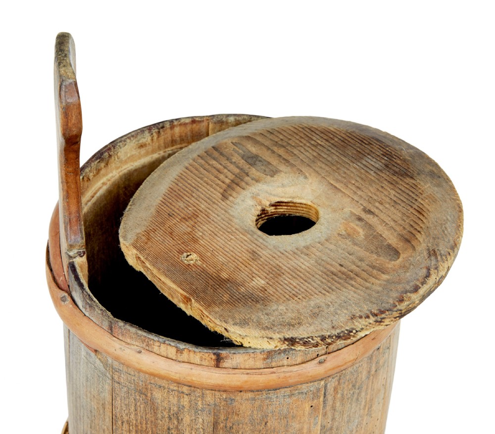 A 19th-century Scandinavian pine plunger butter churn featuring stave construction, wrapped wooden hoops, and a vertical central handle. View IV