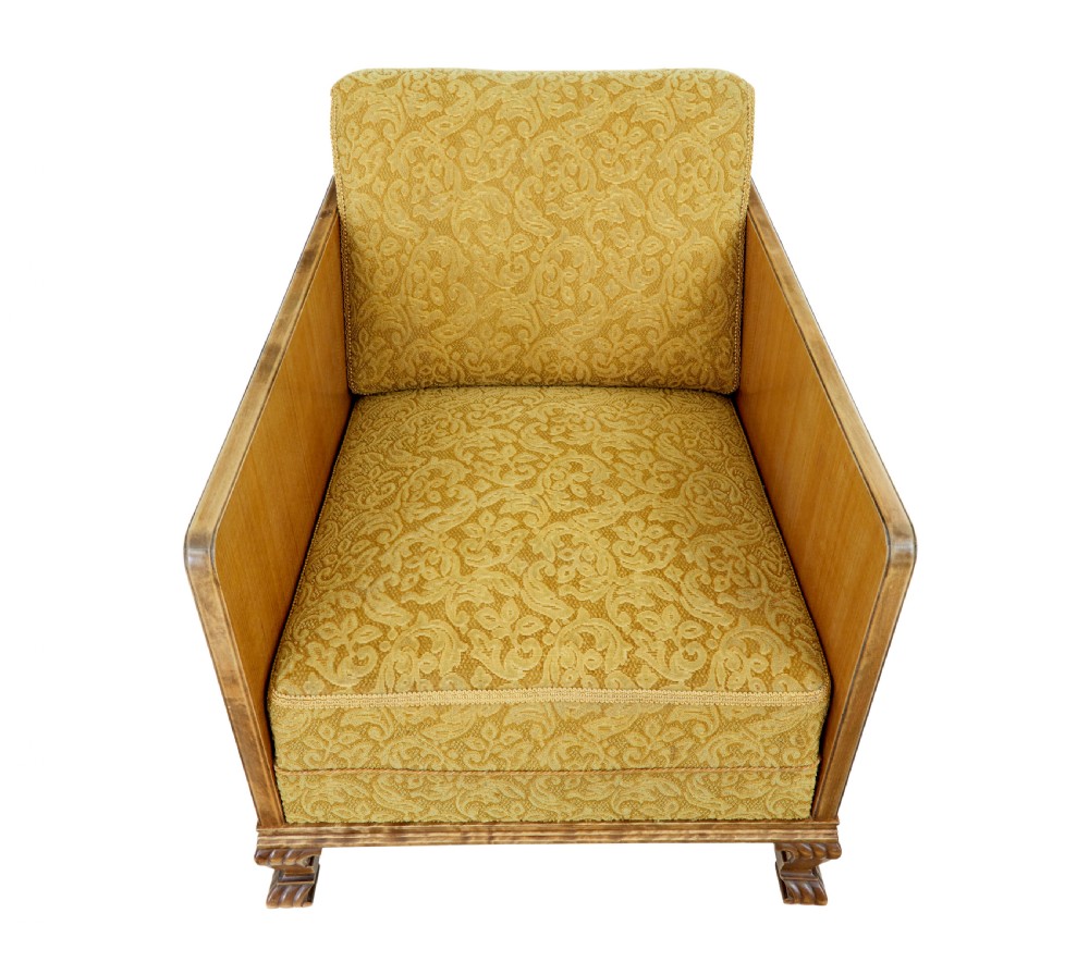 A pair of Art Deco lounge armchairs featuring light birch and elm veneered side panels, golden yellow patterned upholstery, and carved wooden feet. View II