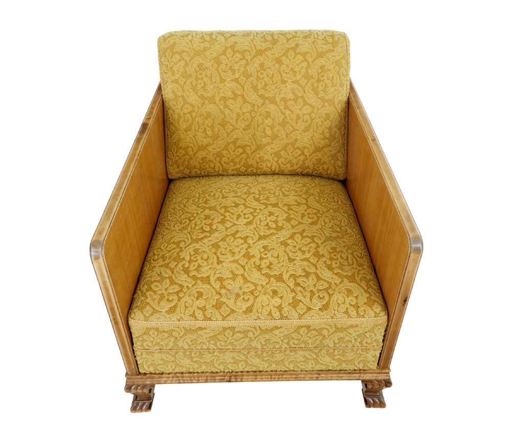 A pair of Art Deco lounge armchairs featuring light birch and elm veneered side panels, golden yellow patterned upholstery, and carved wooden feet. View III