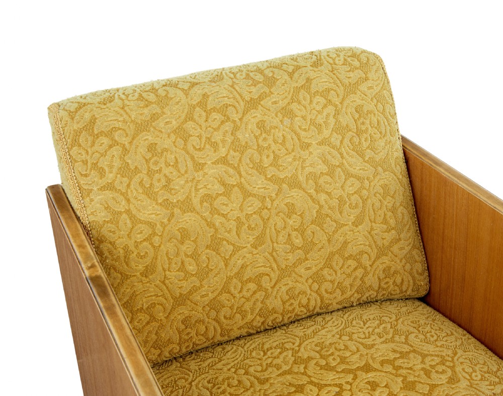 A pair of Art Deco lounge armchairs featuring light birch and elm veneered side panels, golden yellow patterned upholstery, and carved wooden feet. View IV
