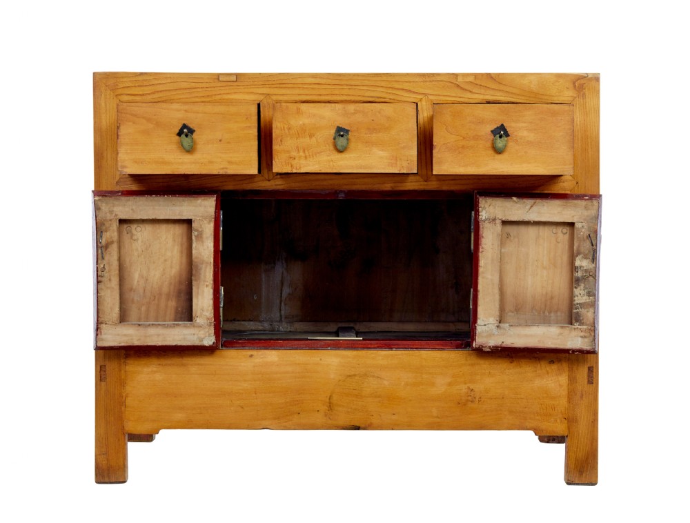 A late nineteenth-century light wood Chinese sideboard featuring three upper drawers over a double-door cupboard with circular brass faceplates. View VI