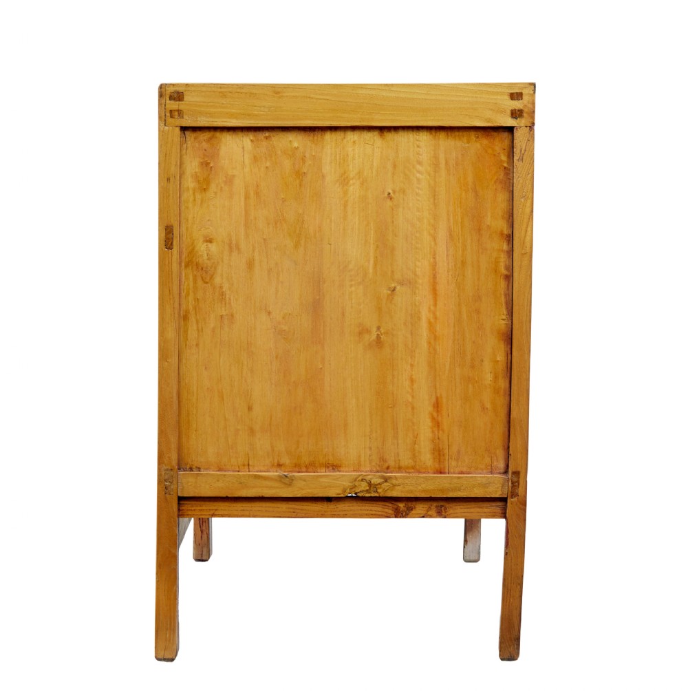 A late nineteenth-century light wood Chinese sideboard featuring three upper drawers over a double-door cupboard with circular brass faceplates. View VII
