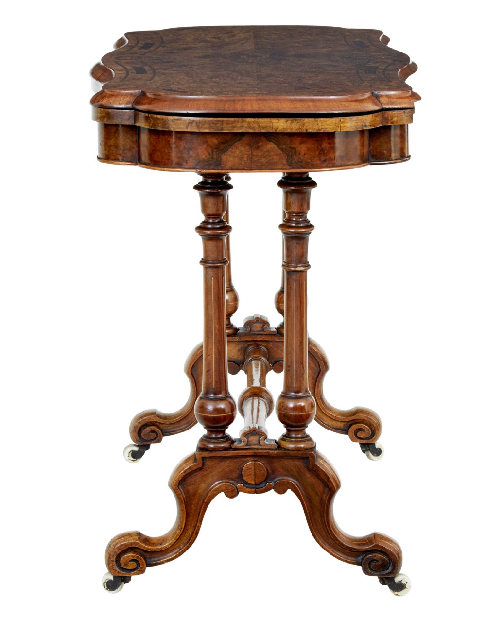 A 19th-century Victorian walnut fold-over card table featuring turned dual pedestal legs, a central stretcher rail, scroll feet, and ceramic castors. View III