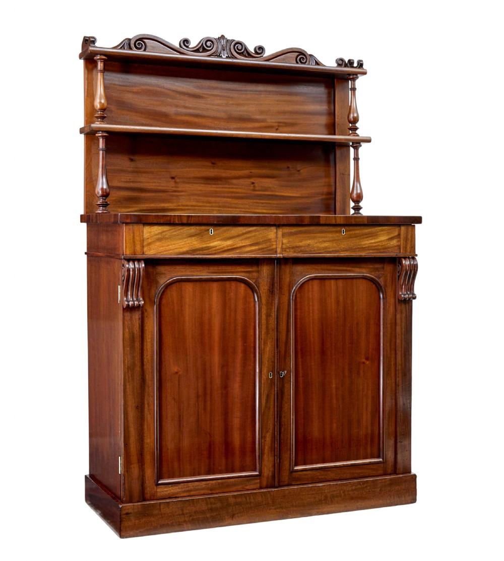 A 19th-century French mahogany chiffonier sideboard with a top display shelf supported by turned spindles, scrolled cresting, two drawers, and a double cupboard base.
