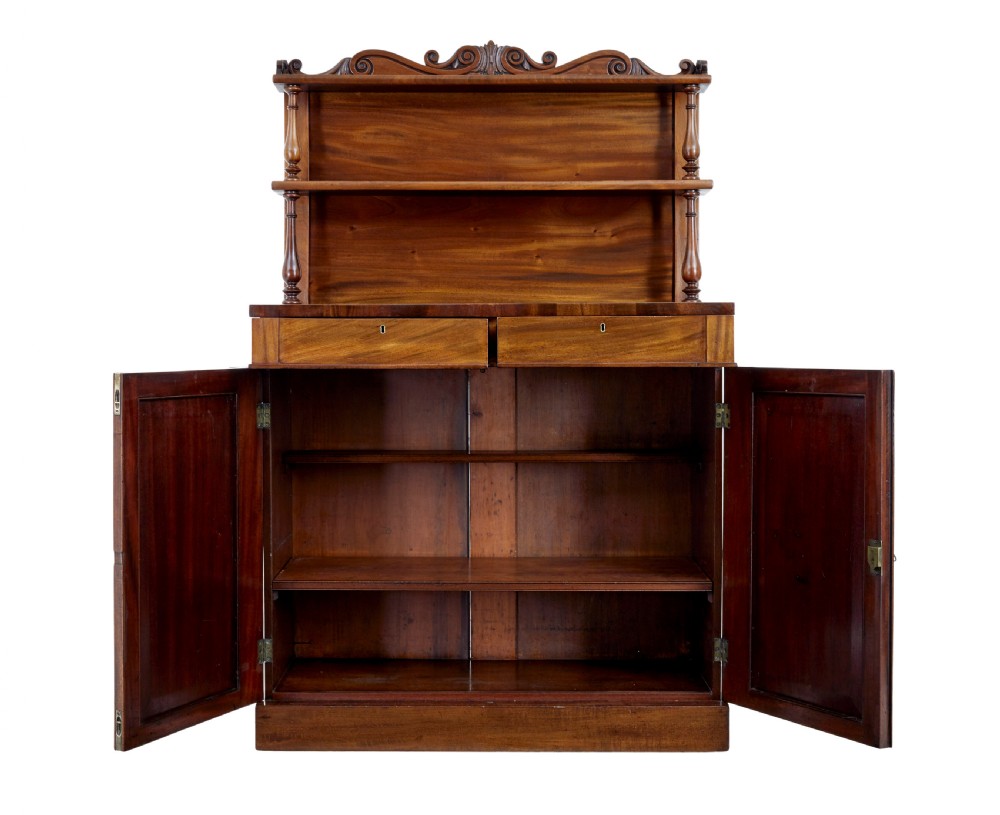 A 19th-century French mahogany chiffonier sideboard with a top display shelf supported by turned spindles, scrolled cresting, two drawers, and a double cupboard base. View III