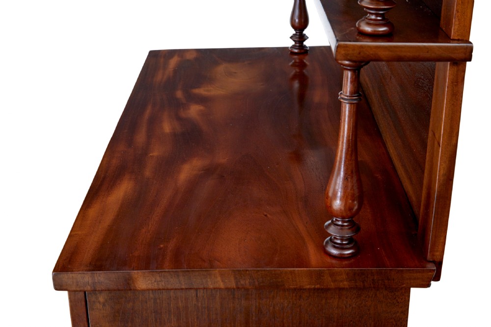 A 19th-century French mahogany chiffonier sideboard with a top display shelf supported by turned spindles, scrolled cresting, two drawers, and a double cupboard base. View VIII