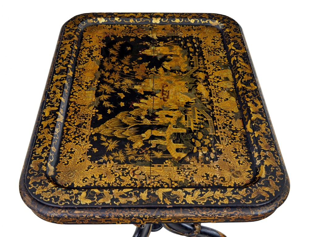 A 19th-century black lacquered pedestal table featuring hand-painted gold chinoiserie motifs, a tray top, turned central column, and tripod feet. View IV