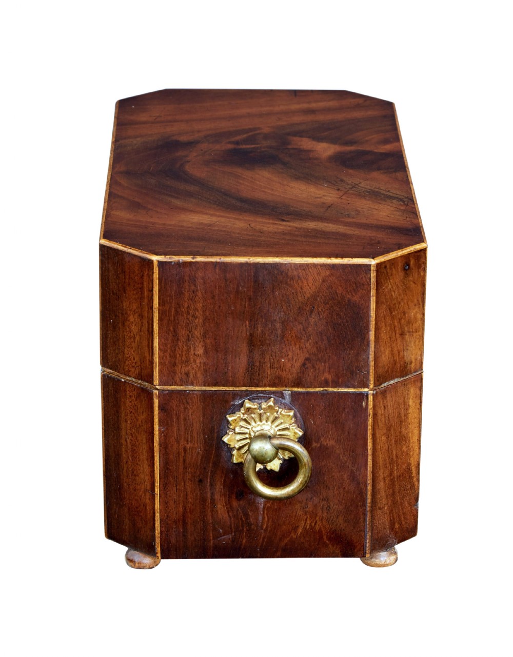 An early 19th-century mahogany tea caddy featuring a canted octagonal shape, brass side ring handles, a brass keyhole escutcheon, and bun feet. View III