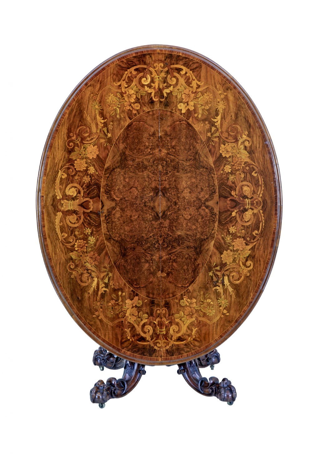 A 19th-century oval walnut tilt-top table with intricate floral marquetry inlay and a carved pedestal base with brass castors. View III