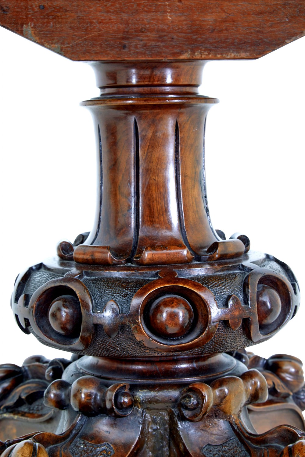 A 19th-century oval walnut tilt-top table with intricate floral marquetry inlay and a carved pedestal base with brass castors. View VIII
