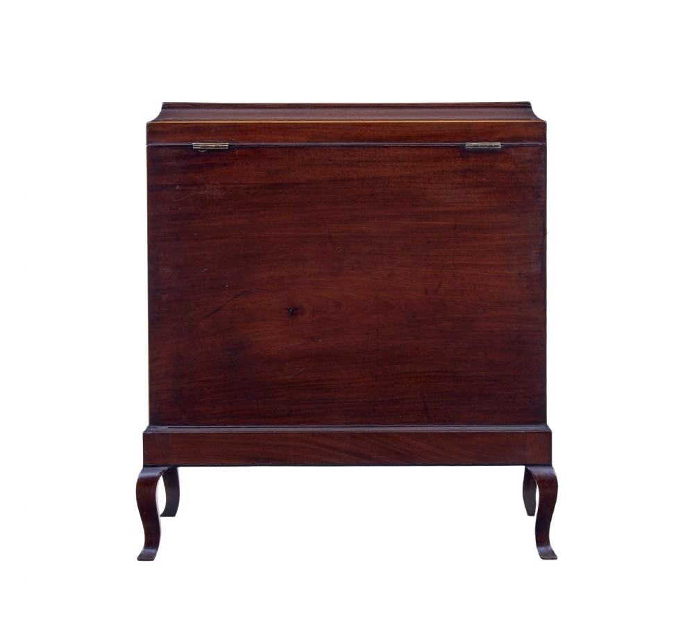 An Edwardian dark mahogany inlaid wine cooler featuring cabriole legs, brass rosette handles, boxwood stringing, and a hinged top lid. View V