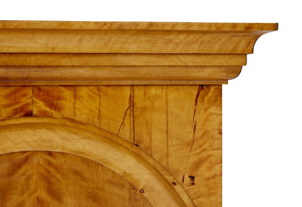 A tall nineteenth-century Swedish Empire revival flame birch pier mirror featuring an arched crest panel, fluted side columns, and a moulded top cornice. View III