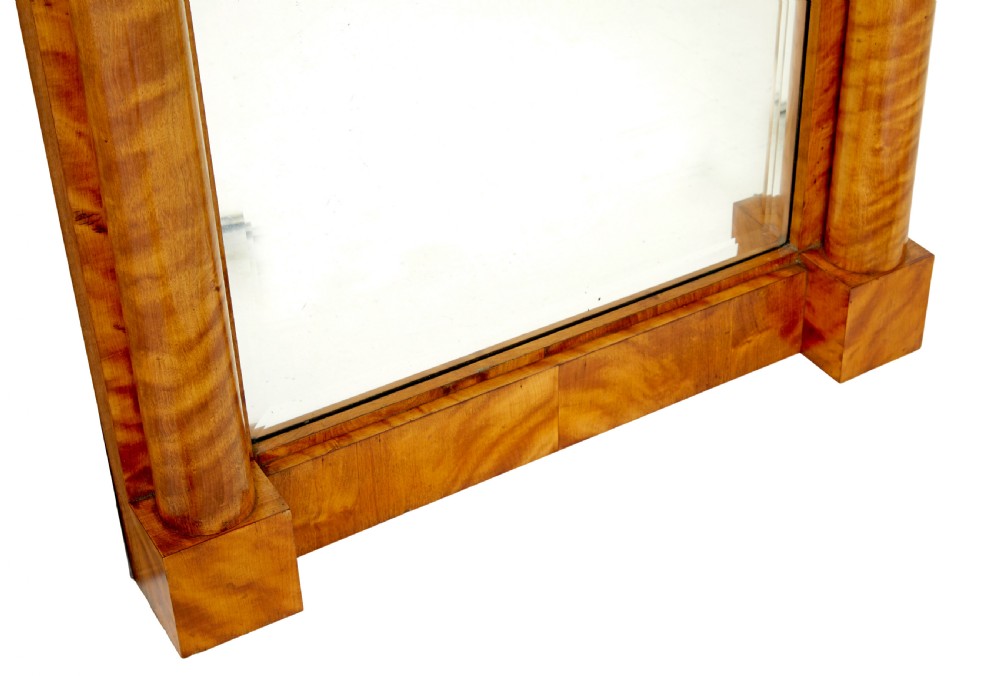 A tall nineteenth-century Swedish Empire revival flame birch pier mirror featuring an arched crest panel, fluted side columns, and a moulded top cornice. View IV