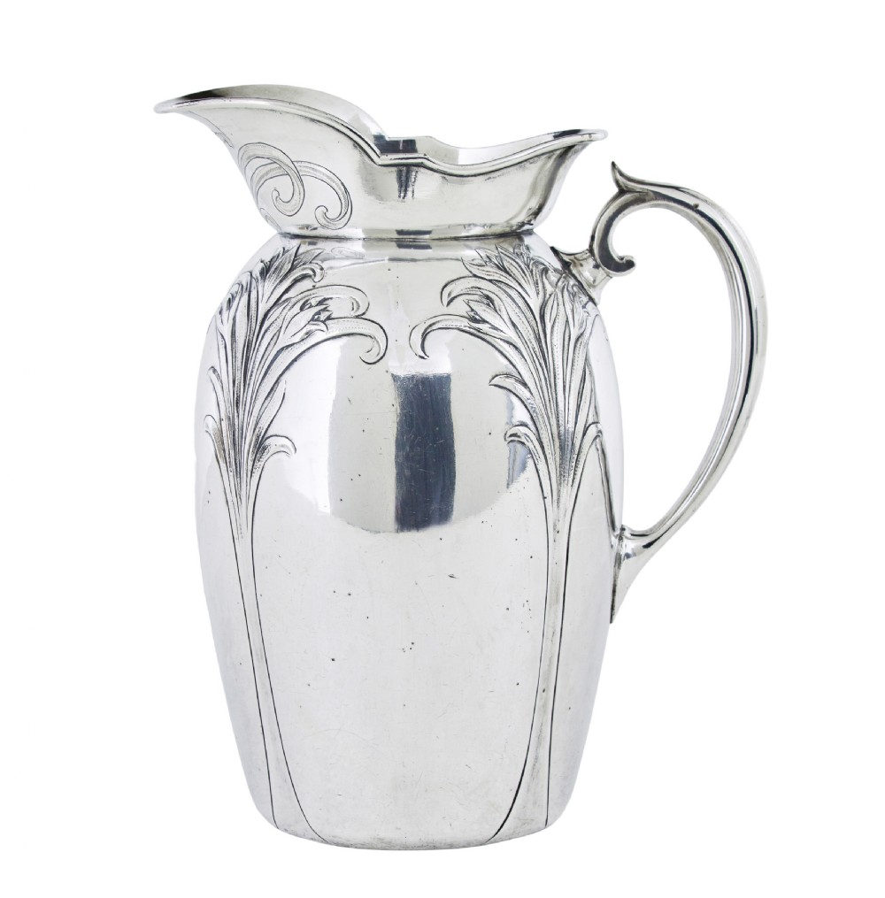 An Art Nouveau silver-plated ewer jug and matching basin set made by Christofle featuring relief-carved botanical foliage details. View II